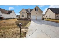 Two-story house with a two-car garage and manicured lawn at 607 Garden Ave., Georgetown, SC 29440