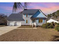 Two-story house with gray siding, blue accents, and a two-car garage at 641 Blackstone Dr., Myrtle Beach, SC 29588