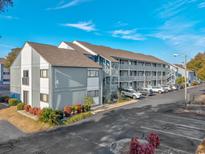 Two-story building with ample parking and landscaping at 7700 Porcher Dr. # 4202, Myrtle Beach, SC 29572