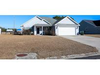 Gray house with a white garage door and a small porch at 132 Blue Jacket Dr., Galivants Ferry, SC 29544
