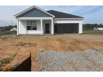New construction home featuring a two-car garage and covered front porch at 234 Letha Dr, Longs, SC 29568
