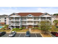 Attractive 3-story building with parking and pool at 5750 Oyster Catcher Dr. # 131, North Myrtle Beach, SC 29582