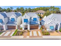 Attractive row of houses with blue shutters and brick driveways at 782 Aqua Dr, Myrtle Beach, SC 29572