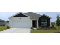 Two-tone exterior house with a white garage door and landscaped lawn at 839 Buttonwood Dr., Conway, SC 29527