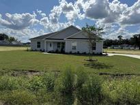 Newly constructed home with a landscaped lawn and driveway at Tbb14 Casey Dr., Green Sea, SC 29545