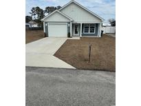 Newly constructed home with gray siding, white trim, and a two-car garage at 1028 Seaside Dr., North Myrtle Beach, SC 29582