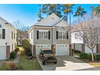 Two-story townhome with attached garage and manicured lawn at 1367 Cottage Dr., Myrtle Beach, SC 29577