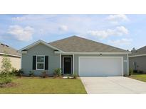 New construction home with gray siding, white garage door, and landscaped lawn at 1423 Porchfield Dr., Conway, SC 29526