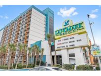 Landmark Resort exterior with signage and parking at 1501 S Ocean Blvd. # 846, Myrtle Beach, SC 29577