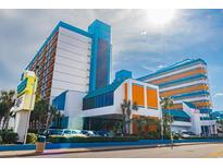 Striking exterior shot of a colorful multi-story hotel, showcasing its unique architectural design at 1501 S Ocean Blvd. S # 1450, Myrtle Beach, SC 29577