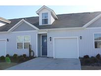 Gray siding two-story home with blue door and attached garage at 3528 Bells Lake Circle # 3528, Longs, SC 29568
