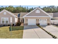 Exterior view of charming craftsman style home with two car garage and landscaped yard at 779 Salerno Circle # 1202 - B, Myrtle Beach, SC 29579
