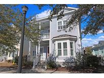 Gray two-story house with white shutters and a front porch at 822 Farrow Pkwy., Myrtle Beach, SC 29577