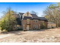 Brick house with a gabled roof and a large yard at 9095 Highway 701 South, Conway, SC 29527