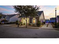 Charming home with a well-maintained yard and cozy front porch, perfect for enjoying quiet evenings at 1541 Waverly Ave., Myrtle Beach, SC 29577