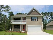 Two-story house with a neutral exterior, red door, and attached garage at 1823 Hardwood Ct., Conway, SC 29526