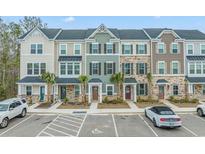 A row of townhomes showcasing varied architectural styles, colors, and front landscaping at 200 Yam Dr. # 22 D, Myrtle Beach, SC 29579