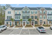 Charming townhomes featuring varied architectural styles, professional landscaping, and convenient parking spaces at 200 Yam Dr. # D, Myrtle Beach, SC 29579