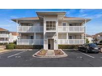 Two-story condo building with parking and landscaping at 300 Shorehaven Dr. # W-4, North Myrtle Beach, SC 29582