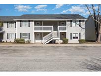 Two-story building with multiple units, balconies, and ample parking at 3555 Highway 544 # 2C, Conway, SC 29526