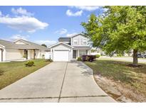 Charming two-story home with long driveway, attached garage and well-manicured front lawn at 395 Thistle Ln., Myrtle Beach, SC 29579