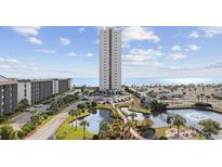 Oceanfront high-rise building with surrounding landscape and parking at 5905 S Kings Hwy. # 312-C, Myrtle Beach, SC 29575