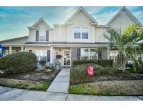 Inviting two-story townhome boasts charming curb appeal at 764 Wilshire Ln. # 764, Murrells Inlet, SC 29576