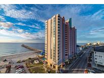 Beautiful exterior shot of the resort by the ocean with scenic views and a nearby pier at 3500 N Ocean Blvd. # 501, North Myrtle Beach, SC 29582