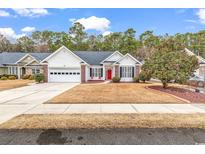 White one-story house with red door, two-car garage, and landscaped yard at 799 Helms Way, Conway, SC 29526