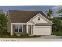Charming single-Gathering home featuring a two-car garage and a well-manicured front yard at 148 Joyce Dr, Longs, SC 29568