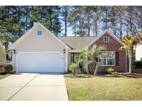 Charming single-story home featuring a two-car garage and a mix of siding and brick facade at 260 Barclay Dr., Myrtle Beach, SC 29579