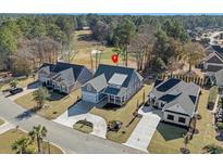 Beautiful home with a well-manicured lawn, long driveway and views of a lush, green golf course at 4340 Parkland Dr., Myrtle Beach, SC 29579