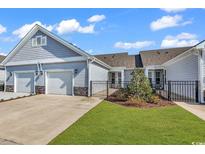 Charming home with a well-manicured lawn and a two-car garage at 801 San Marco Ct. # C, Myrtle Beach, SC 29579