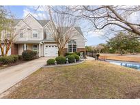 Charming two-story home with an attached garage and a well-manicured lawn with privacy bushes at 1069 Williston Loop # 1069, Murrells Inlet, SC 29576