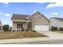 Charming single Gathering home with a two-car garage and well-maintained landscaping at 1361 Midtown Village Dr., Conway, SC 29526