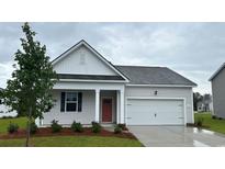 Charming one-story home with a neatly maintained front yard and attached garage at 145 Leyland Cypress Dr, Conway, SC 29527
