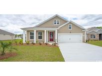 Charming single-story home showcasing a well-manicured lawn, neutral color palette, and a welcoming red door at 152 Leyland Cypress Dr, Conway, SC 29527