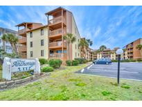 Condo building featuring several stories with parking and tropical landscaping and nearby vacation condo buildings at 5507 N Ocean Blvd. # 304, Myrtle Beach, SC 29577