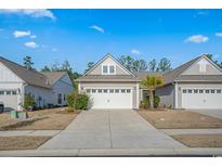 Charming single-story home with a two-car garage, manicured lawn and easy access to the street at 5987 Tramonto St., Myrtle Beach, SC 29577