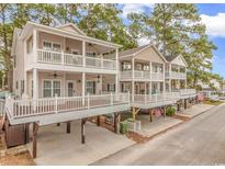 Charming beach homes featuring multiple covered decks, offering beautiful outdoor living spaces and curb appeal at 6001-1383 S Kings Hwy., Myrtle Beach, SC 29575