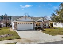 Charming single-story home with a two-car garage, brick accents, and a well-manicured front yard at 1021 Dunraven Ct., Conway, SC 29527