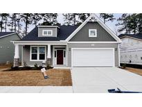 Charming single-Gathering home features a two-car garage, craftsman architecture, and landscaped front yard at 1091 Forest Bend Dr., Calabash, NC 28467