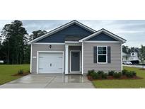 Charming single-story home featuring a one-car garage and neutral colored horizontal siding and dark grey accents at 153 Leyland Cypress Dr, Conway, SC 29527
