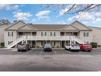 Inviting two-story condo building with ample parking and accessible ramp at 130 Lazy Willow Ln. # 204, Myrtle Beach, SC 29588