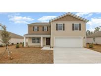 Charming two-story home featuring a two-car garage and welcoming front porch at 1454 Nokota Dr., Conway, SC 29526