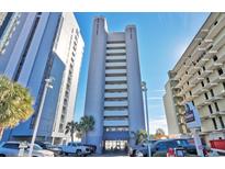 Stunning high-rise condo building with an ocean view and well-maintained landscaping at 2106 N Ocean Blvd. # 410, Myrtle Beach, SC 29572