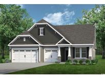 Charming two-story home with a three-car garage, manicured lawn, and stone accents on the facade at 2230 Seagrape Dr., Little River, SC 29566