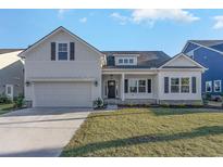 Charming single-Gathering home with a well-manicured lawn and an attached two-car garage at 621 Woodside Dr., Conway, SC 29526