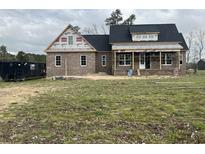New brick home under construction with a dark roof and covered front porch at 713 Horry Rd., Conway, SC 29526