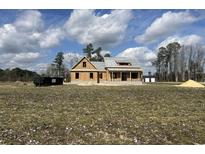 An unfinished exterior of a house with a yard, blue skies and a bright sunny day at 713 Horry Rd., Conway, SC 29526